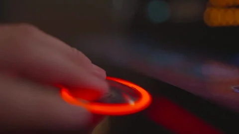 Slow motion hand pressing slot machine button Stock Footage 334047313