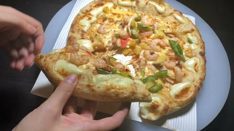 Slow motion of the hand taking one slice of hot pizza Stock-Footage 93009689