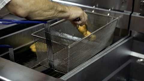Slow Motion Hand taking out last Zeppole from Williamsburg Brooklyn Stock Footage 252330749