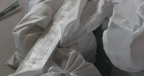Slow motion handheld shot of construction garbage in bags 動画素材 88221489