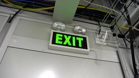 Slow Motion Handheld Shot of Exit Sign Above Modern Data Center Server Room Video stock 341695376