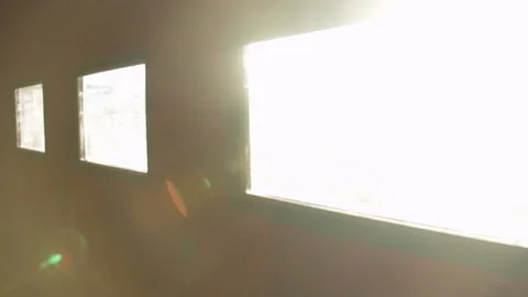 Slow motion handheld shot of sun coming through windows Stock Footage 131153728