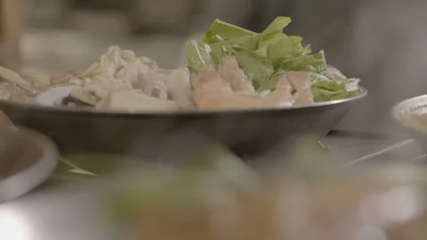 Slow Motion Handheld Steaming Hot Pot Seafood Bowl Smoke Billowing Restaurant Stock Footage 335719888