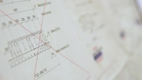 Slow motion handheld track over blueprints Stock Footage 131156023