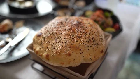 Slow Motion Of Hands Breaking A Freshly Baked Loaf Of Bread Stock Footage 180347441