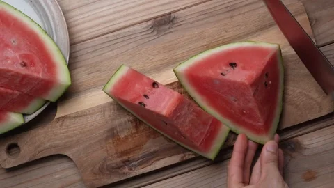 Slow Motion Hands Cutting Watermelon into Wedges Stock-Footage 307463882
