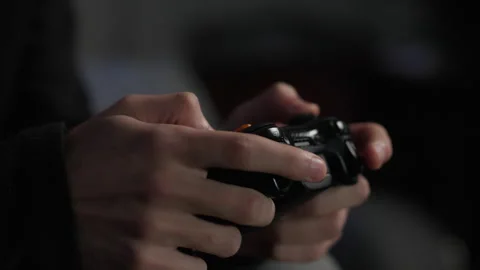 Slow Motion Hands Holding A Controller Playing Video Games, Extreme Close-up Stock Footage 307704646
