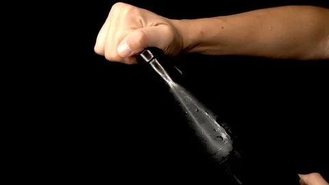 Slow motion hands opening the cork of a bottle of red wine Video stock 94352662