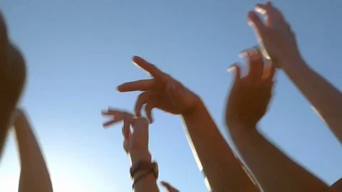 Slow motion of hands raised up to the sky in summer Stock Footage 73350817