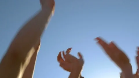 Slow motion of hands raised up to the sky in summer Stock Footage 73350843