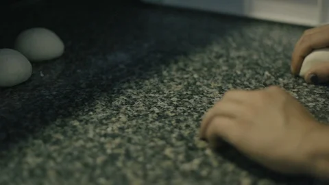 Slow Motion of hands rolling in dough Stock Footage 86170100