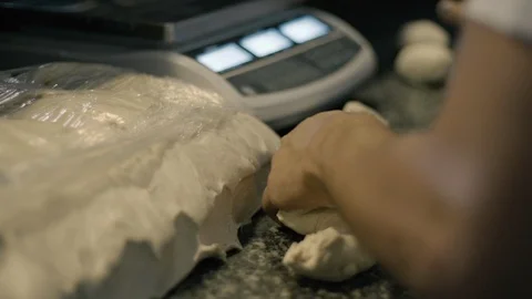 Slow Motion of hands rolling in dough Stock Footage 86170192