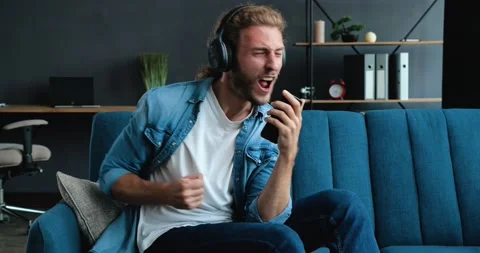 Slow motion of handsome Bearded Hipster guy have Fun jumping dancing on bed and 動画素材 137600729