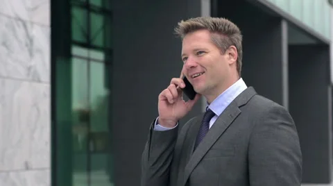 Slow Motion Of Handsome Businessman Talking On The Phone Stock Footage 35240764
