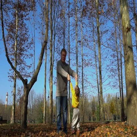 Slow motion of handsome father throwing his adorable daughter in the air Stock Footage 69675518