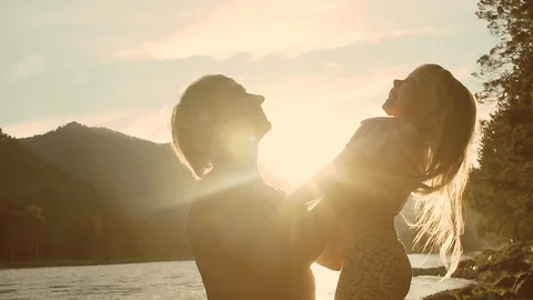 Slow motion of handsome father throwing his adorable daughter in the air Stock Footage 93769409