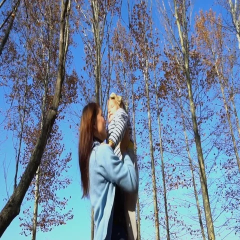 Slow motion of handsome mother throwing his adorable daughter in the air Video stock 69671900