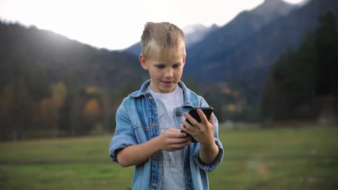 Slow motion a happy boy very happy and smiling gift the background of a bright Video stock 129779580