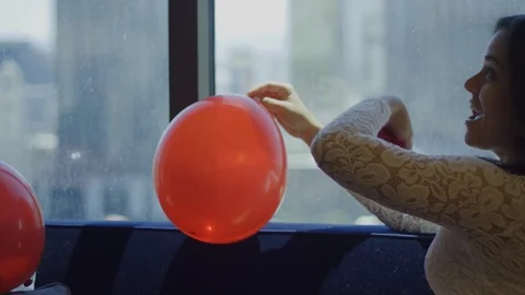 Slow motion of happy bride with balloon throwing rose petals to air Stock Footage 115925100
