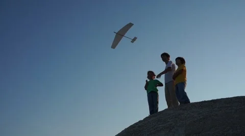 Slow motion: Happy Child Playing with an airplane on a meadow Stockbeeldmateriaal 66761004