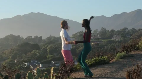 Slow Motion of Happy Mixed Race Couple Dancing. Amazing View At Sunset  Stock Footage 201821267