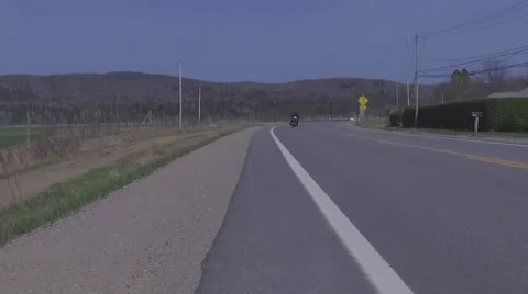 Slow motion harley davidson riding scenic area Stock Footage 63074756