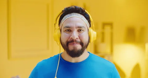 Slow motion headshot of handsome bearded young man showing OK hand sign while Stock Footage 165870197