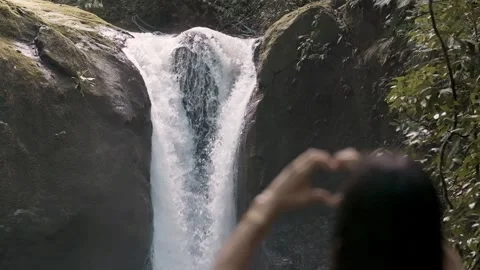 Slow-Motion Heart in front of Waterfall, Costa Rica Stock Footage 309894265