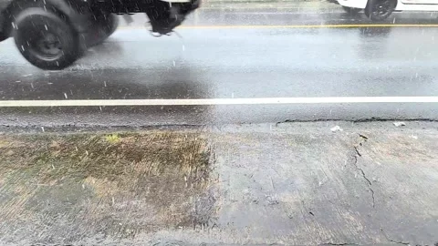 Slow Motion Heavy Rain Droplets Splashing on Wet Asphalt Street Stock Footage 335350980