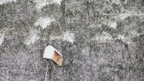 Slow motion heavy snowfall on a mailbox Stock Footage 128304540