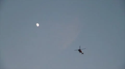 Slow Motion Helicopter and Moon Stock Footage 52932908