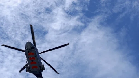 Slow Motion Helicopter FLying From the Bottom. Stock Footage 129581872
