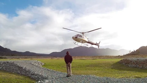 Slow motion helicopter landing Stock Footage