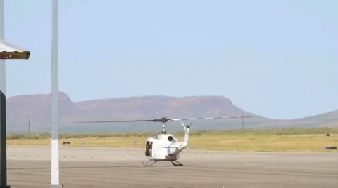 Slow Motion Helicopter Propellers Spinning on the Tarmac Stock Footage 60847458