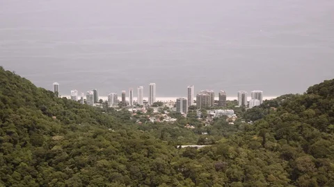 Slow motion helicopter view of tower blocks and coastline in rio de janeiro Stock Footage 96130833