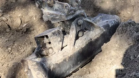 Slow Motion High Angle of Excavator Bucket Pulling Soil Stock Footage 332595387