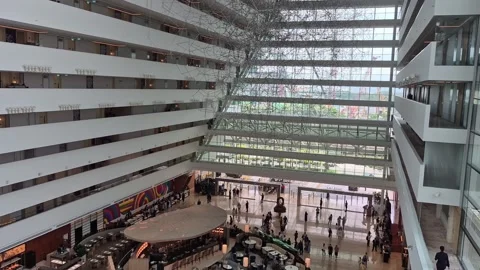 Slow Motion High Angle View of Marina Bay Sands Hotel Atrium in Singapore Stock Footage 346599338