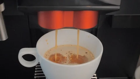 Slow motion: highest quality coffee latte made with a coffee machine Stock Footage 107785062
