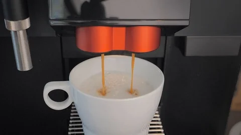 Slow motion: highest quality coffee latte made with a coffee machine Stock Footage 107785235