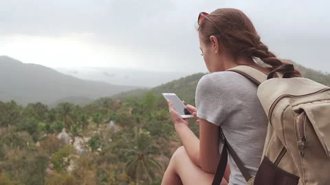 Slow motion a hiker with a backpack on a background of mountains and wildlife Stock Footage 139869365