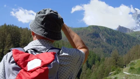 Slow motion hiker looking at beautiful landscape - Commercially Usable Stock Footage 93273926