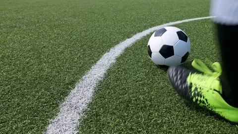 Slow motion of hitting the ball with a corner line on a green football field Video stock 106376402