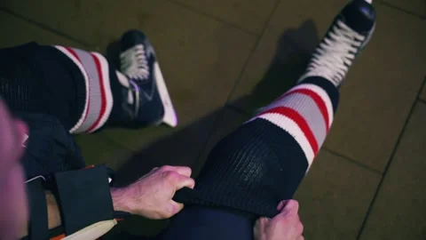 Slow motion hockey player getting dressed in the locker room before the game Stock Footage 152247824