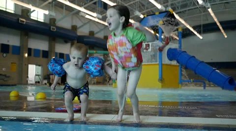 Slow motion hold hand and jump into the pool. Stock Footage 38721485