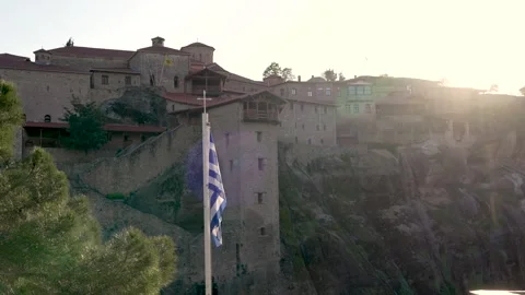 Slow Motion Holy Monastery of Great Meteoron Greek Flag Waving in Meteora S.. Video stock 334871094