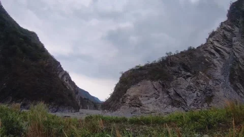 Slow motion horizontal pane view look out to grand canyon boulder rocky mountain Stock Footage 265492655