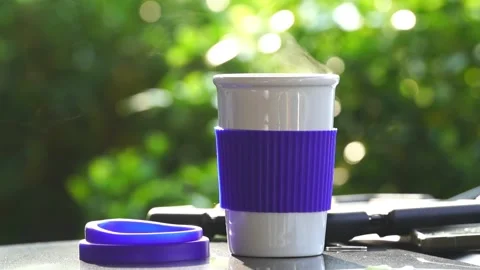 Slow motion. Hot ceramic white coffee cup with smoke Stockbeeldmateriaal 253248681