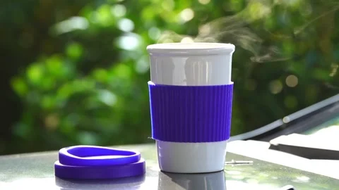 Slow motion. Hot ceramic white coffee cup with smoke Stockbeeldmateriaal 253248691