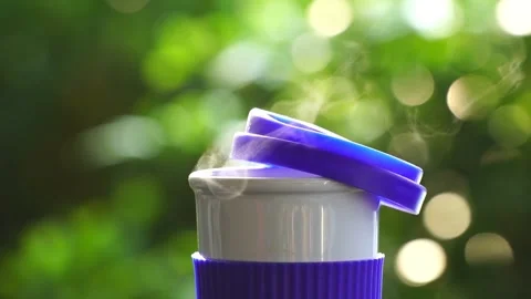 Slow motion. Hot ceramic white coffee cup with smoke Stockbeeldmateriaal 253248694