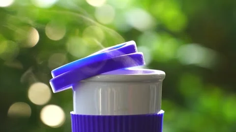 Slow motion. Hot ceramic white coffee cup with smoke Stockbeeldmateriaal 253248847